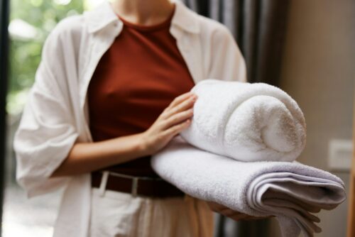 Woman clean hygiene towel hotel home service stack female background laundry closeup